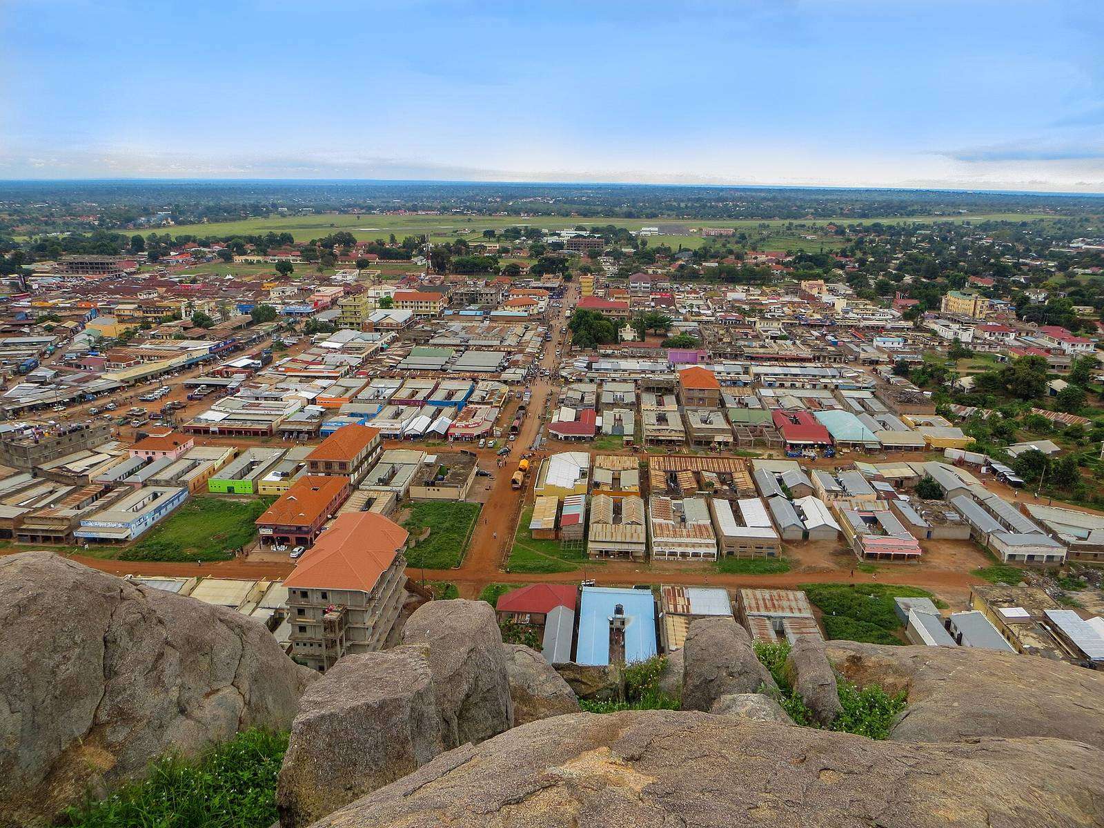 Soroti laid out below from the top of Soroti Rock — bare granite boulders in the foreground,