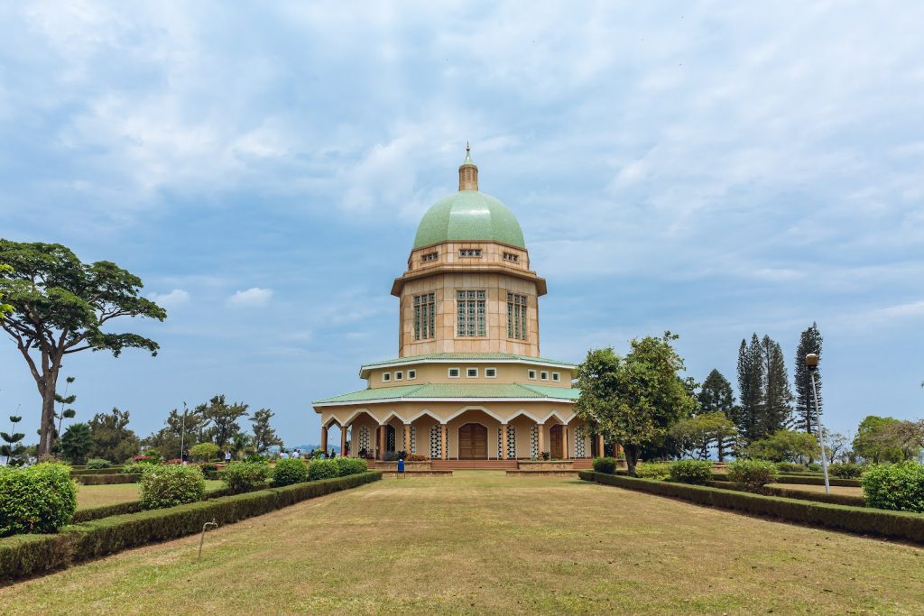 The domed Baha'i House of Worship in Kampala seen across its formal lawns and gardens